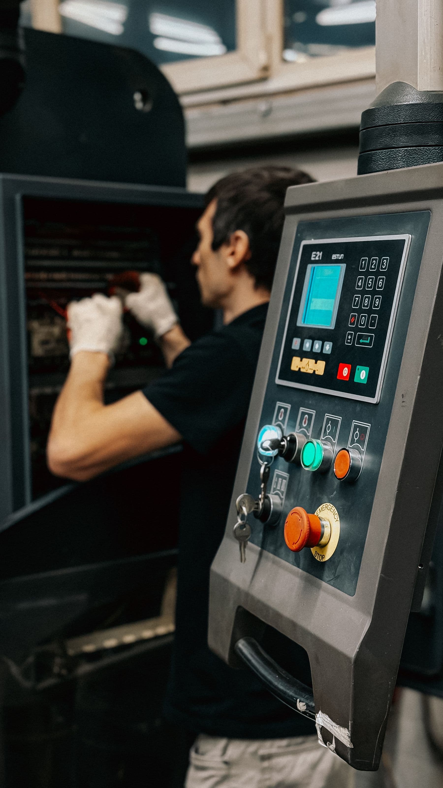 Technician at plant control panel — stock photograph